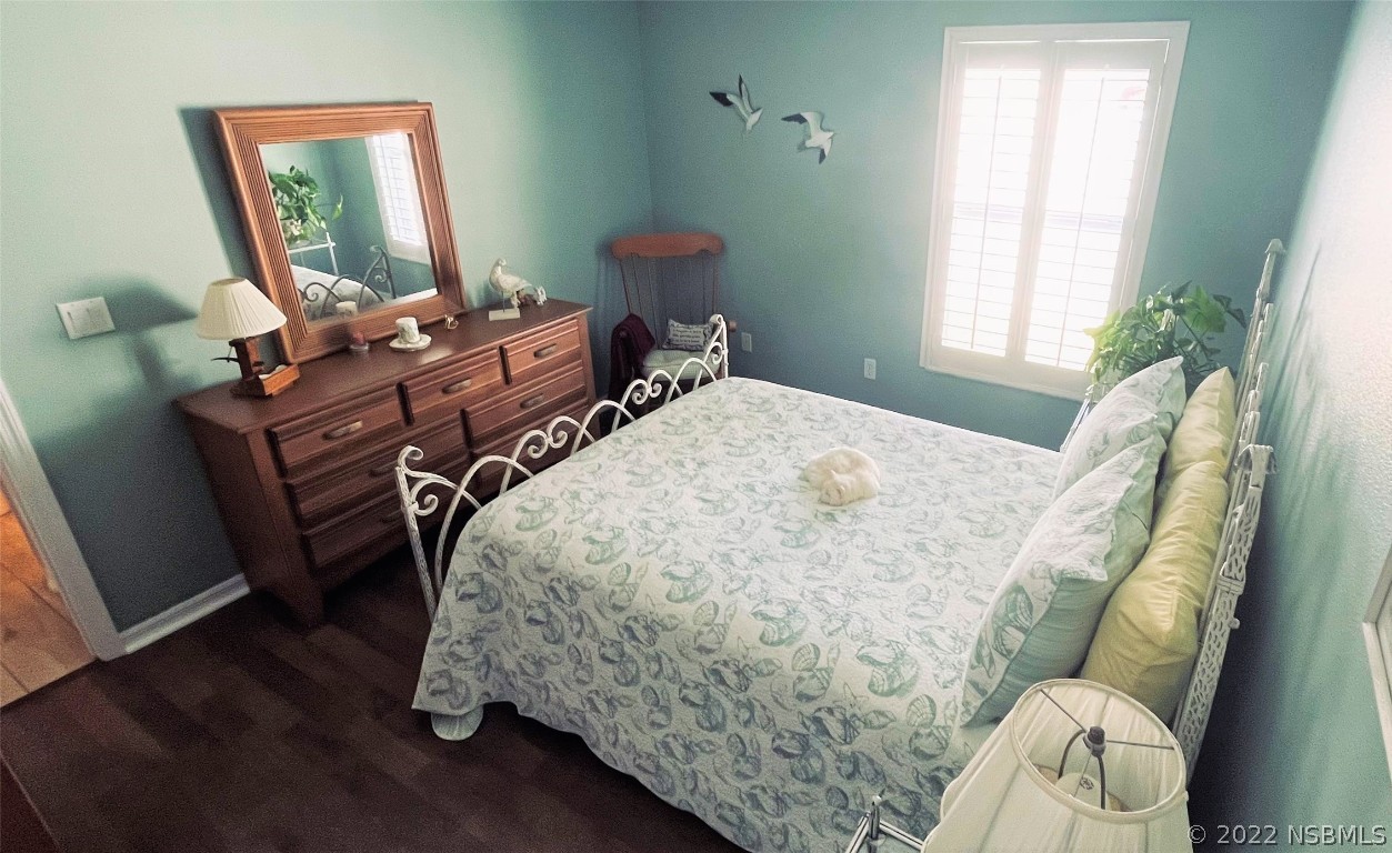 2924 Royal Palm Drive Edgewater, FL 32141 - Photo 39 of 43 a bed sitting in a bedroom next to a window