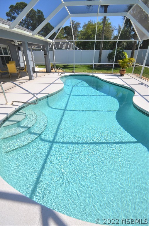 2924 Royal Palm Drive Edgewater, FL 32141 - Photo 8 of 43 a view of a swimming pool with a patio and couches