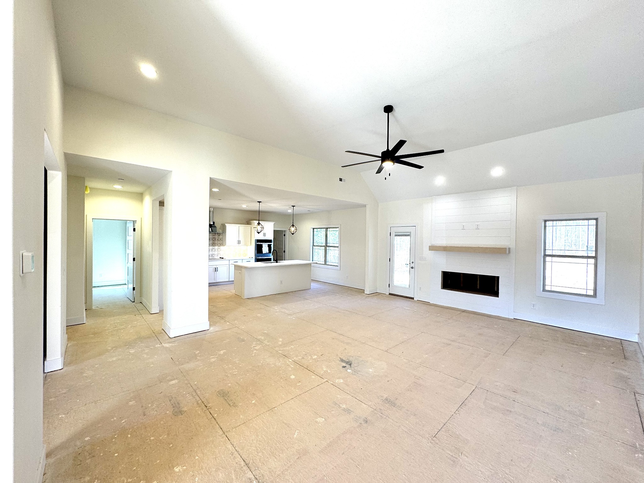390 Young Lane Pleasant View, TN 37146 - Photo 11 of 48 a view of an empty room with a fireplace and a window