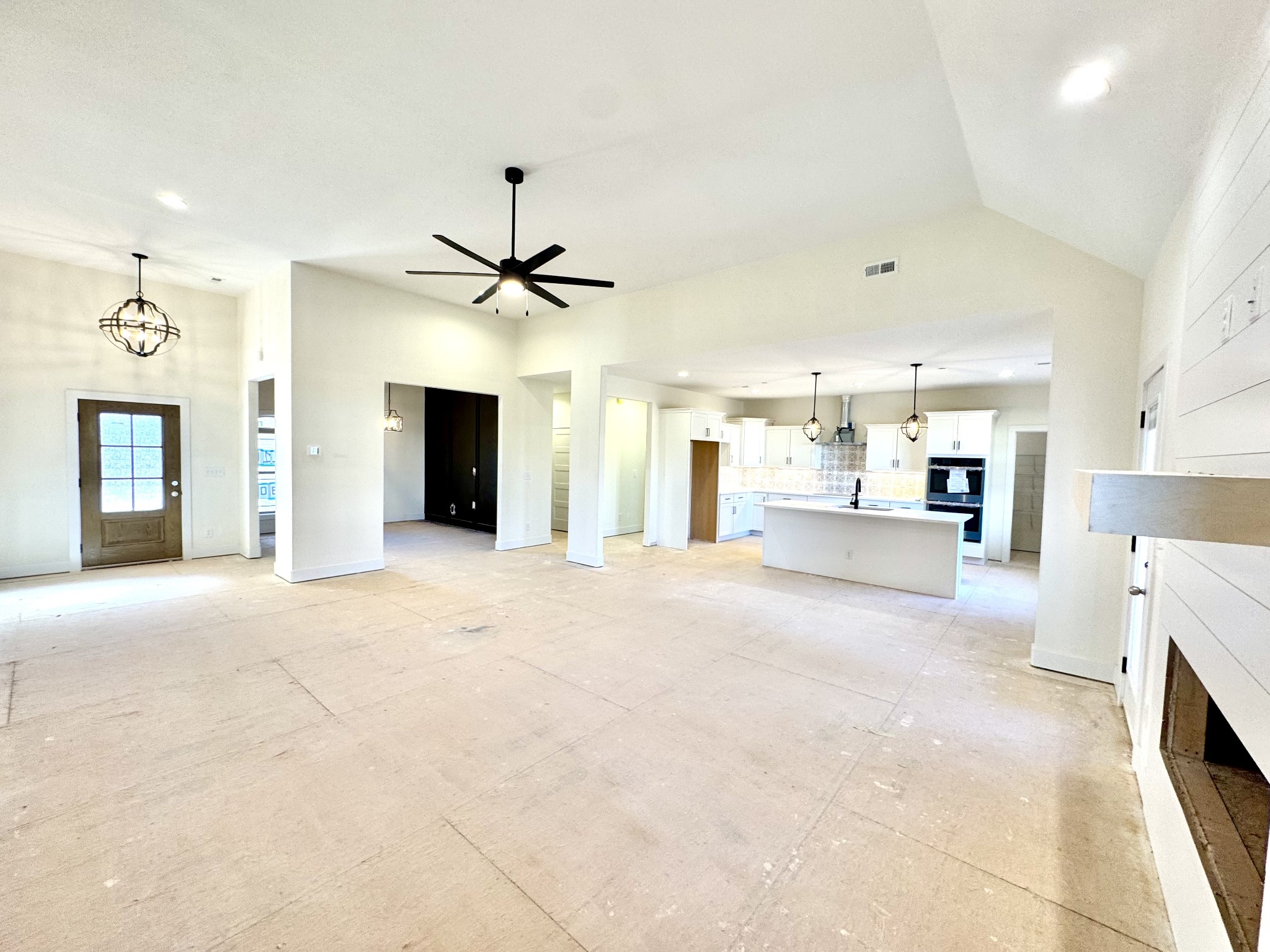 390 Young Lane Pleasant View, TN 37146 - Photo 12 of 48 a view of a kitchen with furniture and a ceiling fan