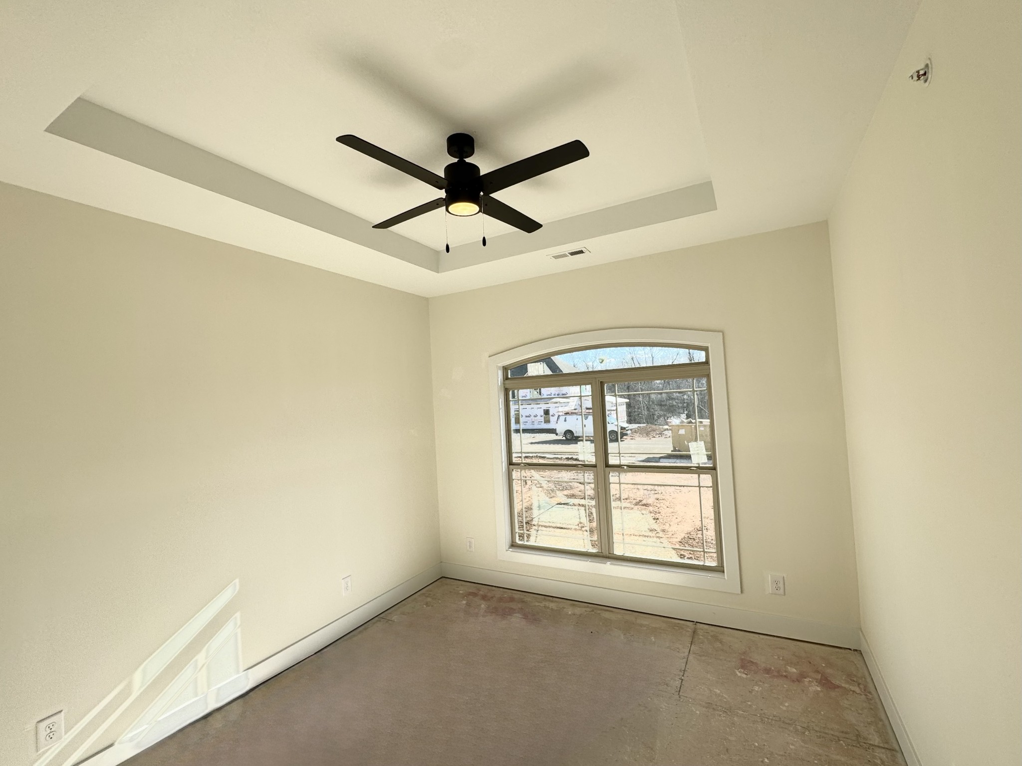 390 Young Lane Pleasant View, TN 37146 - Photo 29 of 48 an empty room with a window and a fan