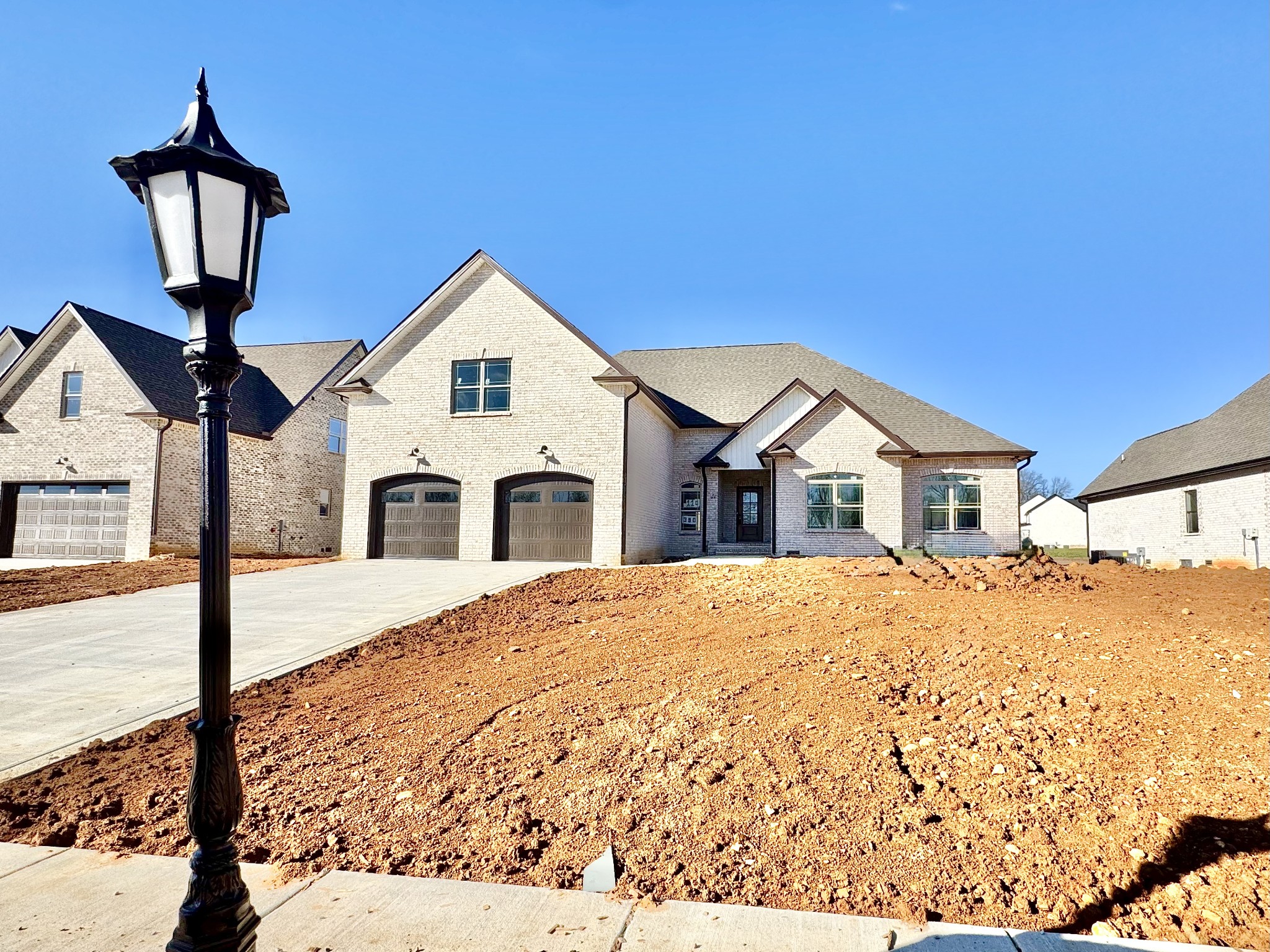 390 Young Lane Pleasant View, TN 37146 - Photo 3 of 48 a front view of a house with a yard