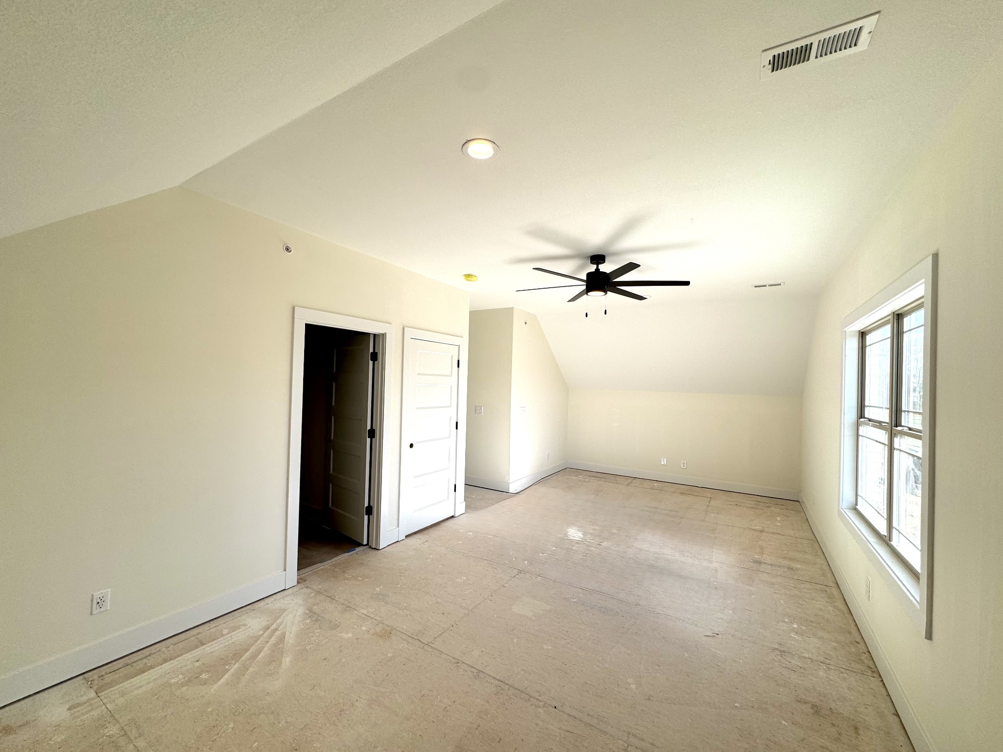 390 Young Lane Pleasant View, TN 37146 - Photo 43 of 48 an empty room with chandelier fan and windows