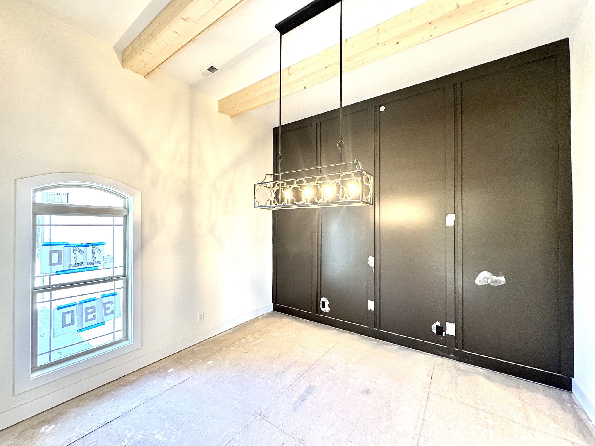 390 Young Lane Pleasant View, TN 37146 - Photo 9 of 48 a view of a big room with windows and chandelier