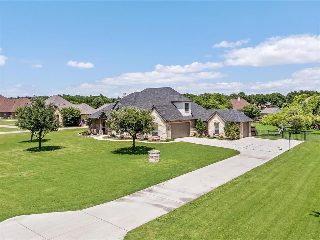 111 Old Base Road Aurora, TX 76078 - Photo 34 of 38 Beautifully updated custom home situated on a one-acre lot in Aurora Vista with mature landscaping, stone accents, and exceptional curb appeal.