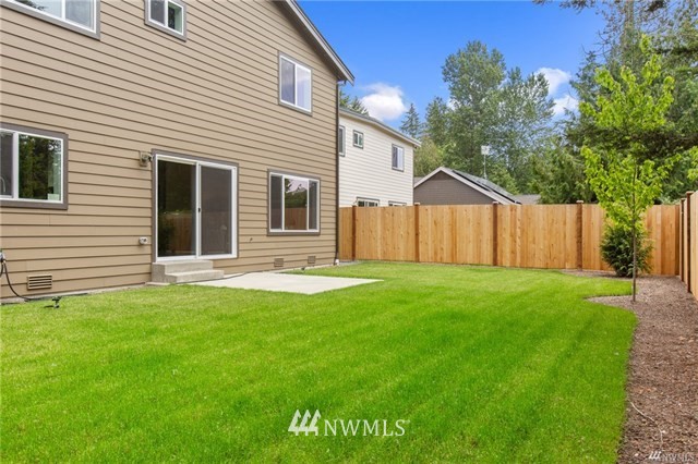 1616 230th Street Southwest Bothell, WA 98021 - Photo 22 of 25 a backyard of a house with table and chairs