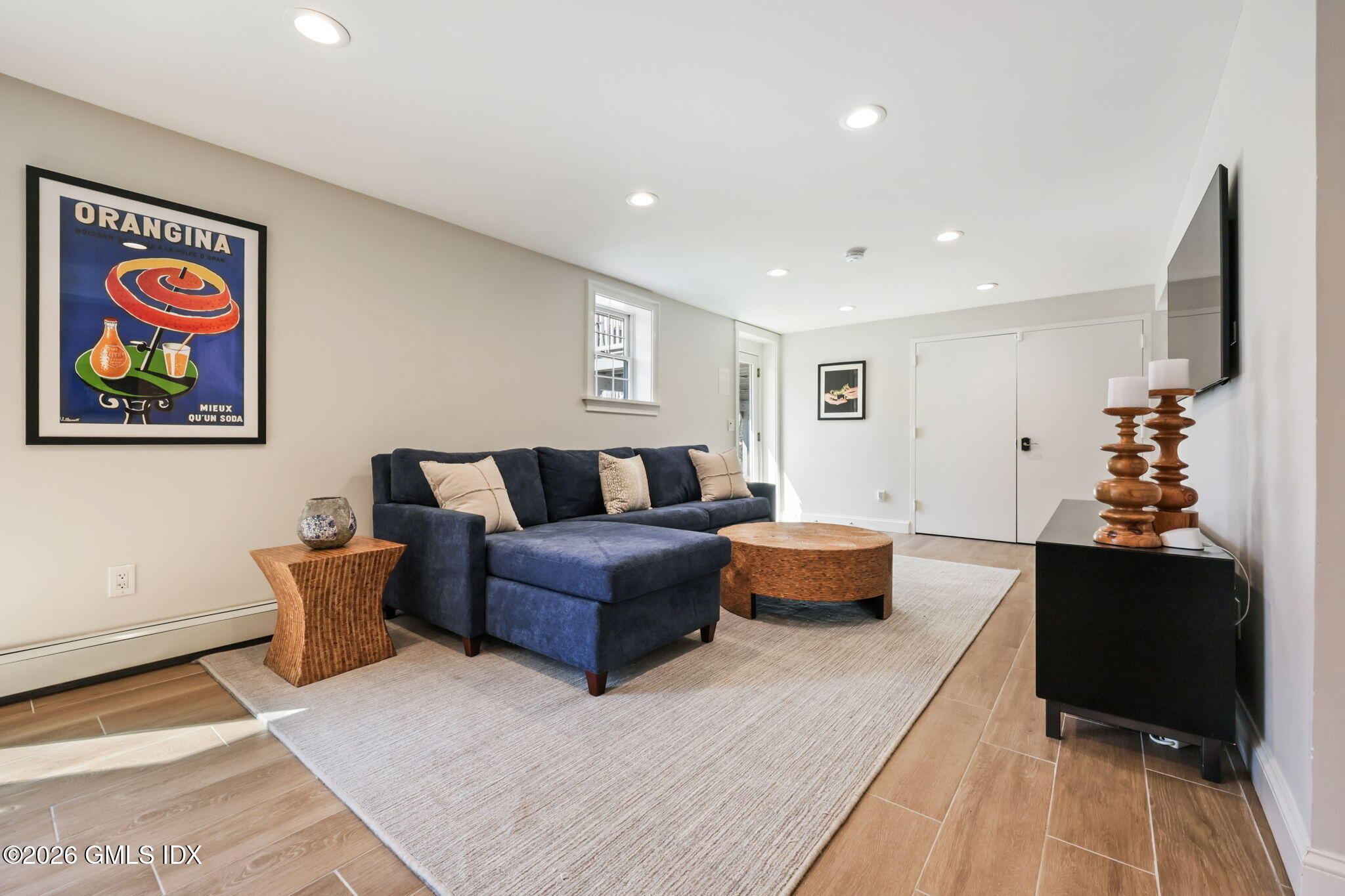 97 Davenport Ridge Lane Stamford, CT 06903 - Photo 22 of 31 a living room with furniture and wooden floor