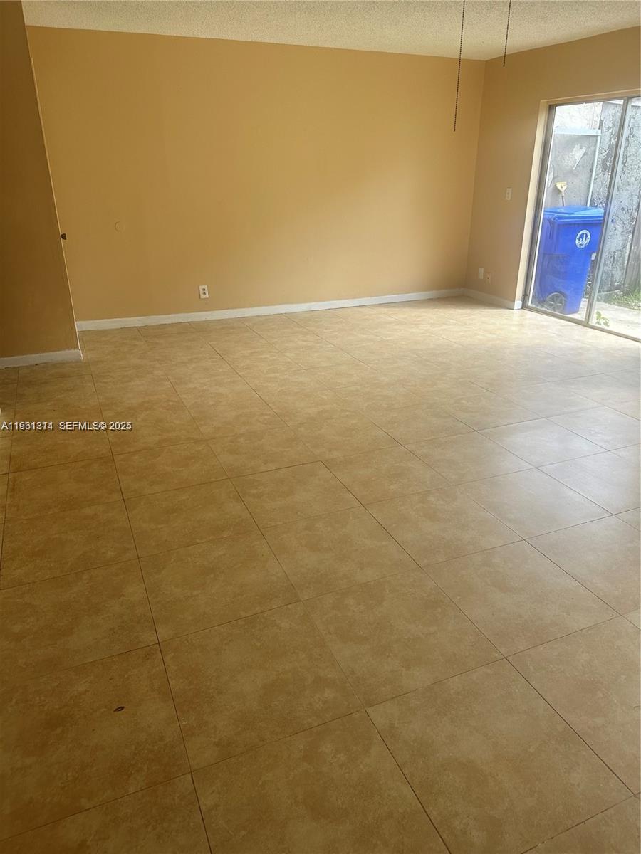 948 Southwest 74th Avenue North Lauderdale, FL 33068 - Photo 3 of 10 a view of an empty room