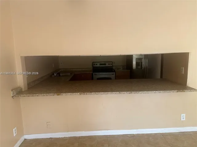 an empty room with wooden floor and closet
