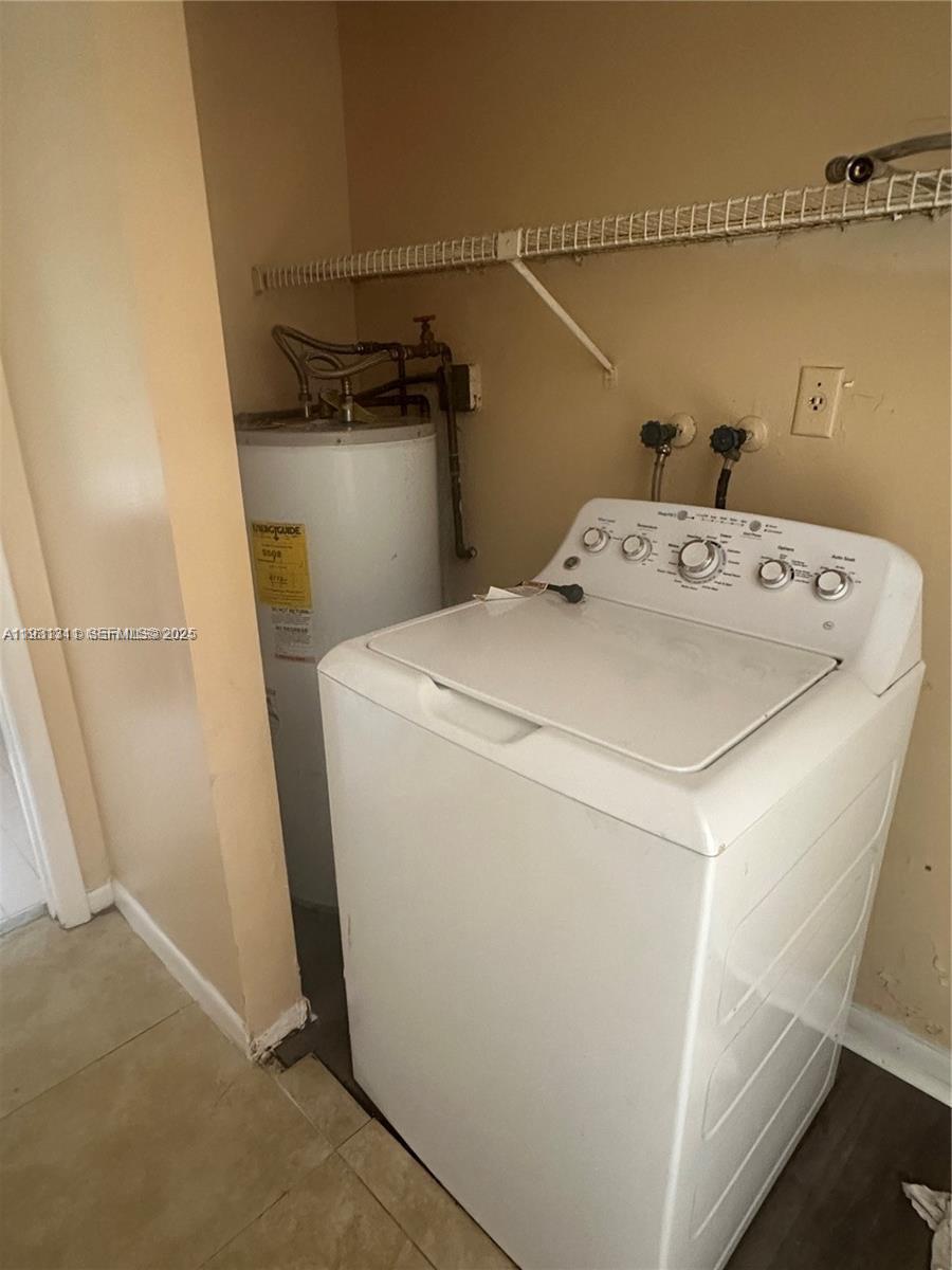 948 Southwest 74th Avenue North Lauderdale, FL 33068 - Photo 9 of 10 a utility room with dryer and washer
