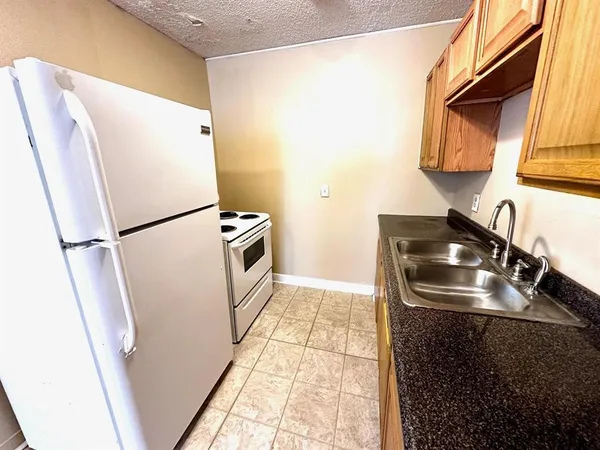 a view of a kitchen with car parked