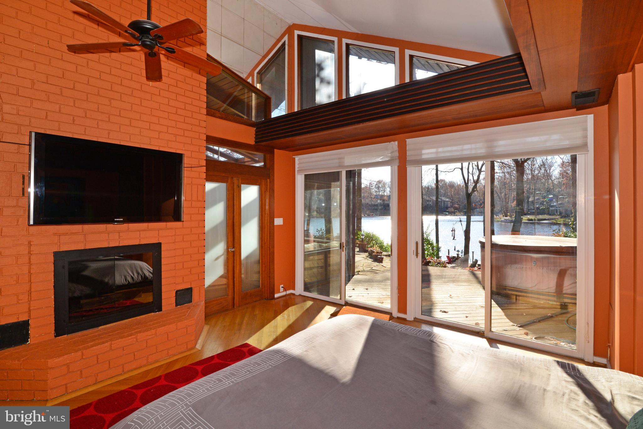 1934 Upper Lake Drive Reston, VA 20191 - Photo 37 of 60 Sliding glass doors lead to the deck, patio &lake.