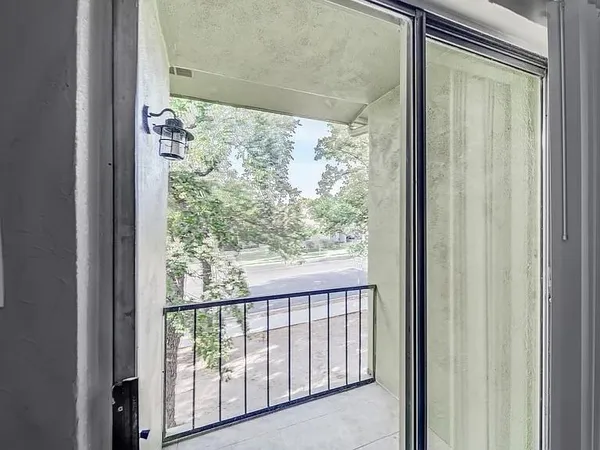 a view of a glass door with a balcony