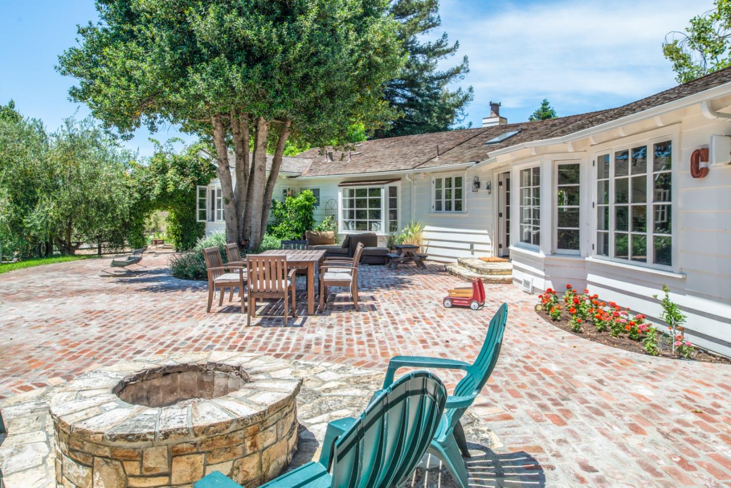 8990 West Carmel Valley Road Carmel Valley, CA 93923 - Photo 12 of 50 a view of a patio with couches table and chairs and potted plants