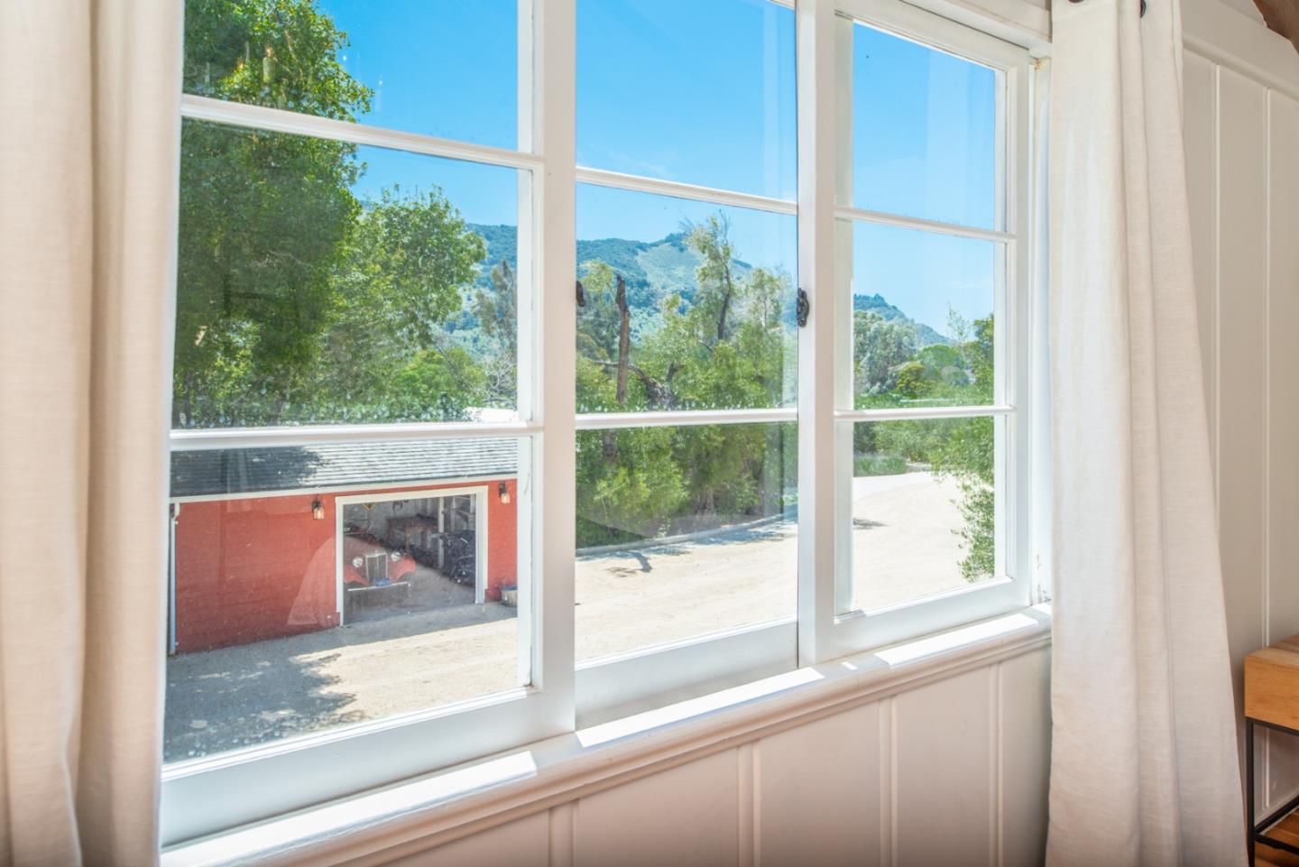 8990 West Carmel Valley Road Carmel Valley, CA 93923 - Photo 21 of 50 a view of a glass door with a from a window