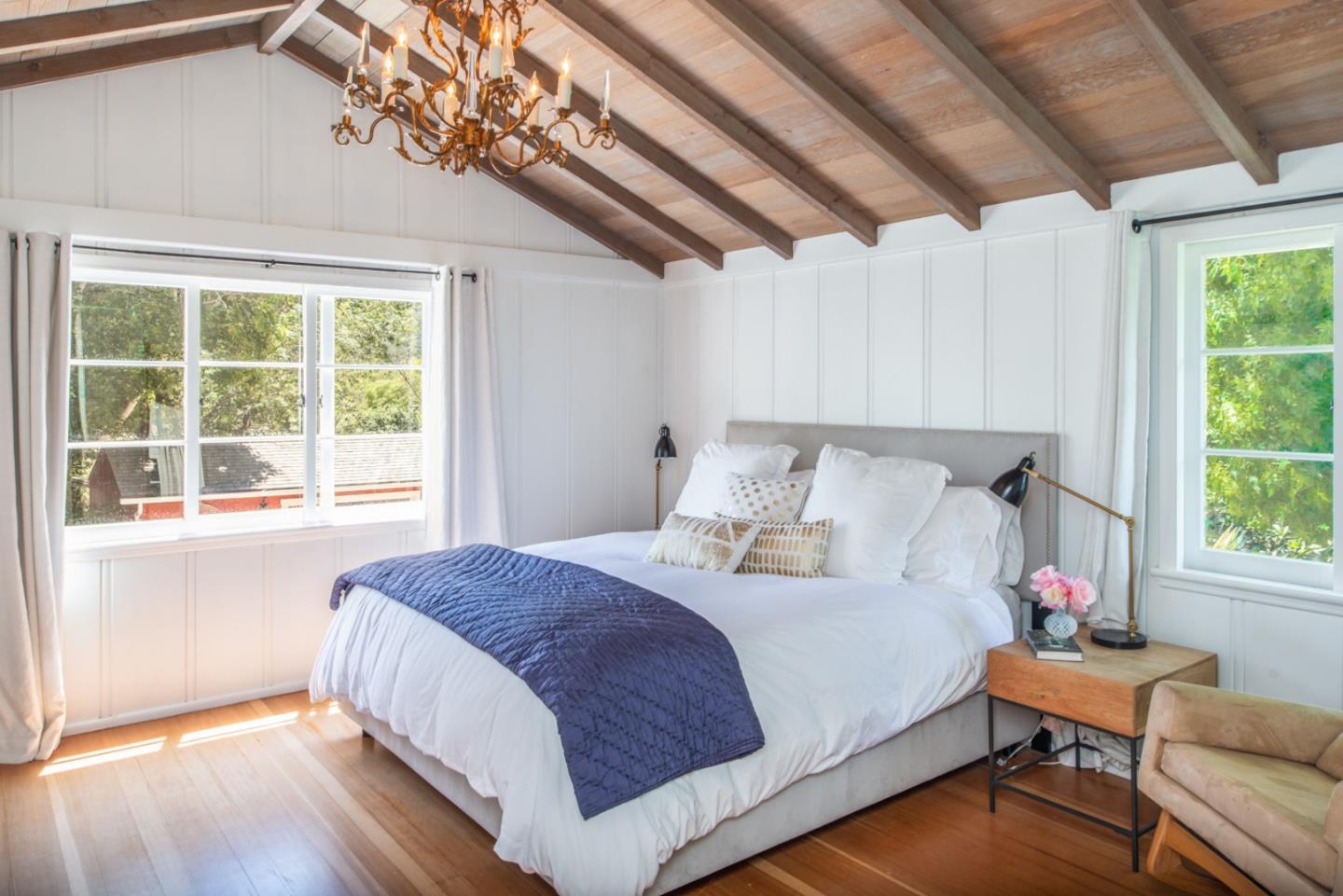 8990 West Carmel Valley Road Carmel Valley, CA 93923 - Photo 22 of 50 a bedroom with a bed and a window with outer view