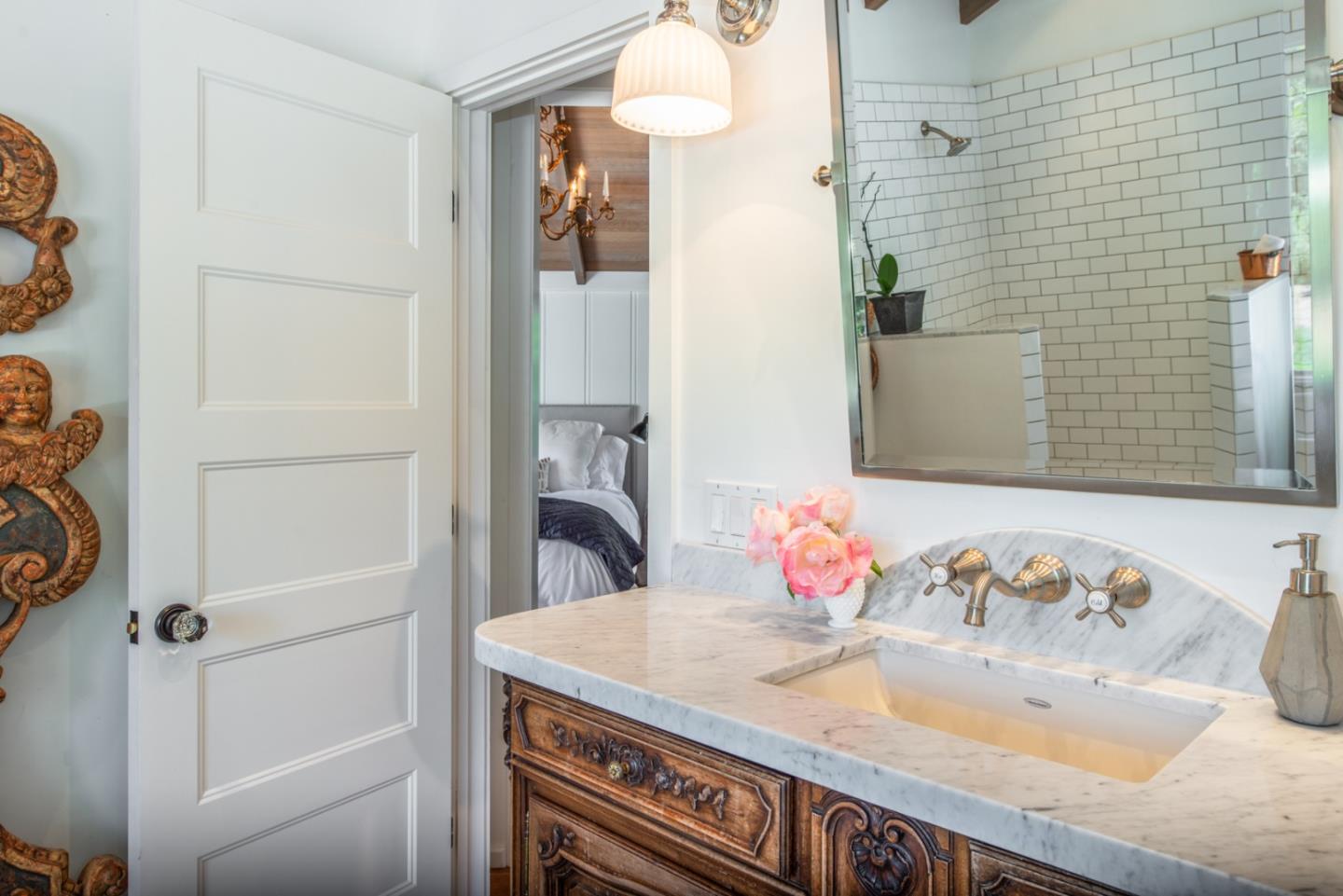 8990 West Carmel Valley Road Carmel Valley, CA 93923 - Photo 24 of 50 a bathroom with a granite countertop sink and a mirror