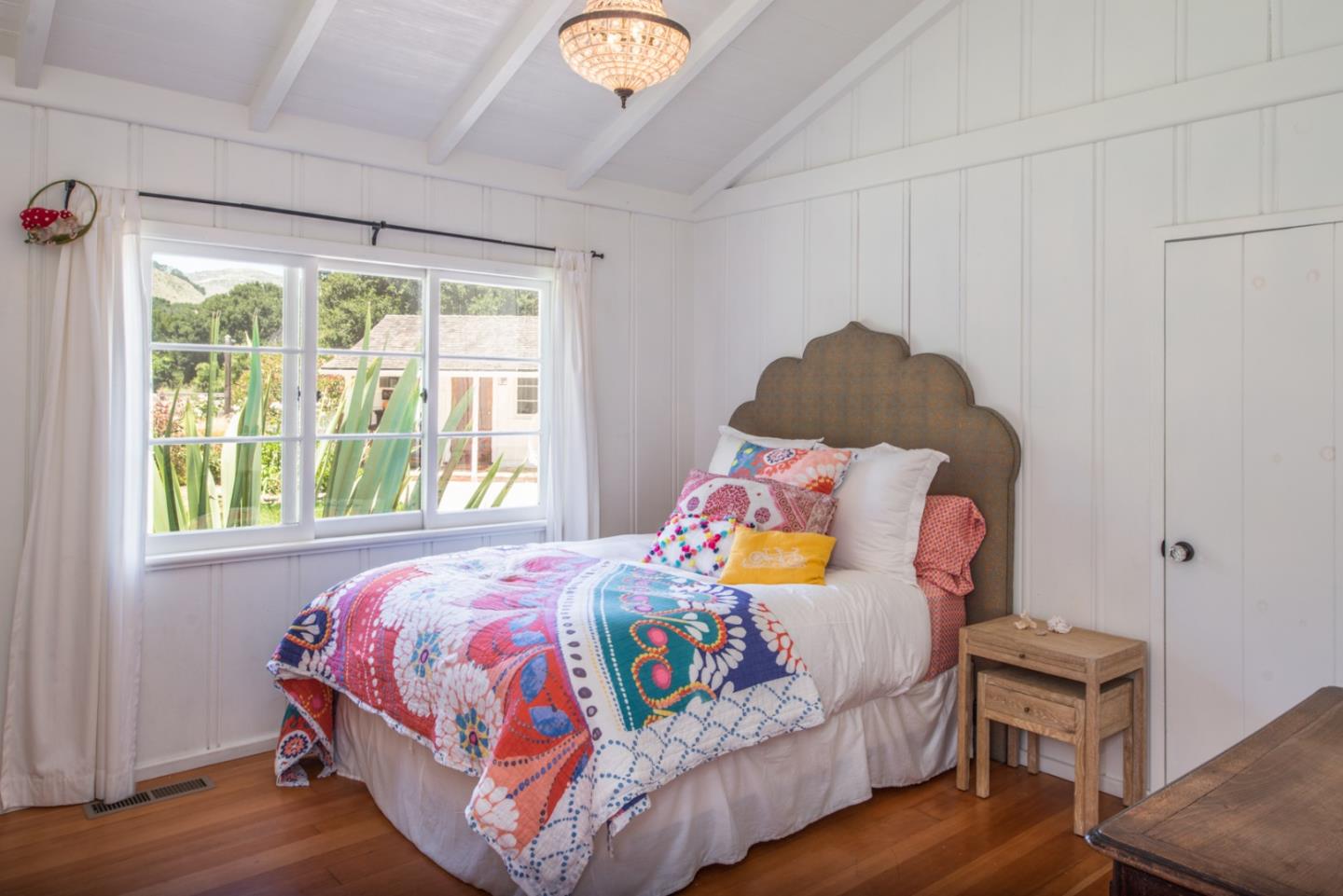8990 West Carmel Valley Road Carmel Valley, CA 93923 - Photo 25 of 50 a bedroom with a bed and a window
