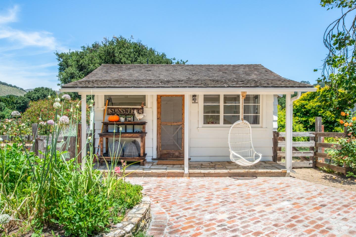 8990 West Carmel Valley Road Carmel Valley, CA 93923 - Photo 29 of 50 a front view of a house with a porch