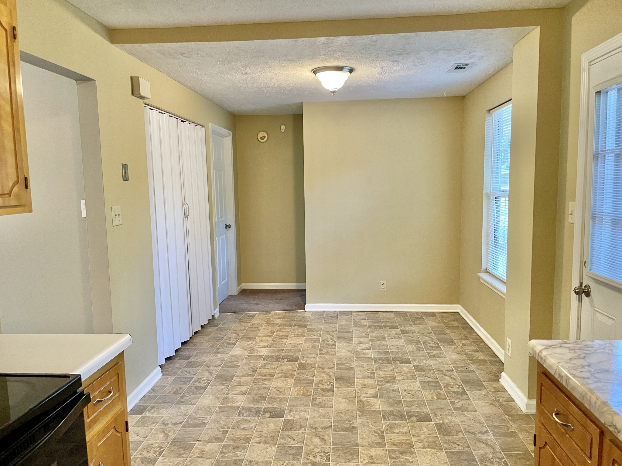 9193 Pembroke Oak Grove Road Oak Grove, KY 42262 - Photo 11 of 16 a view of a hallway with a dining area