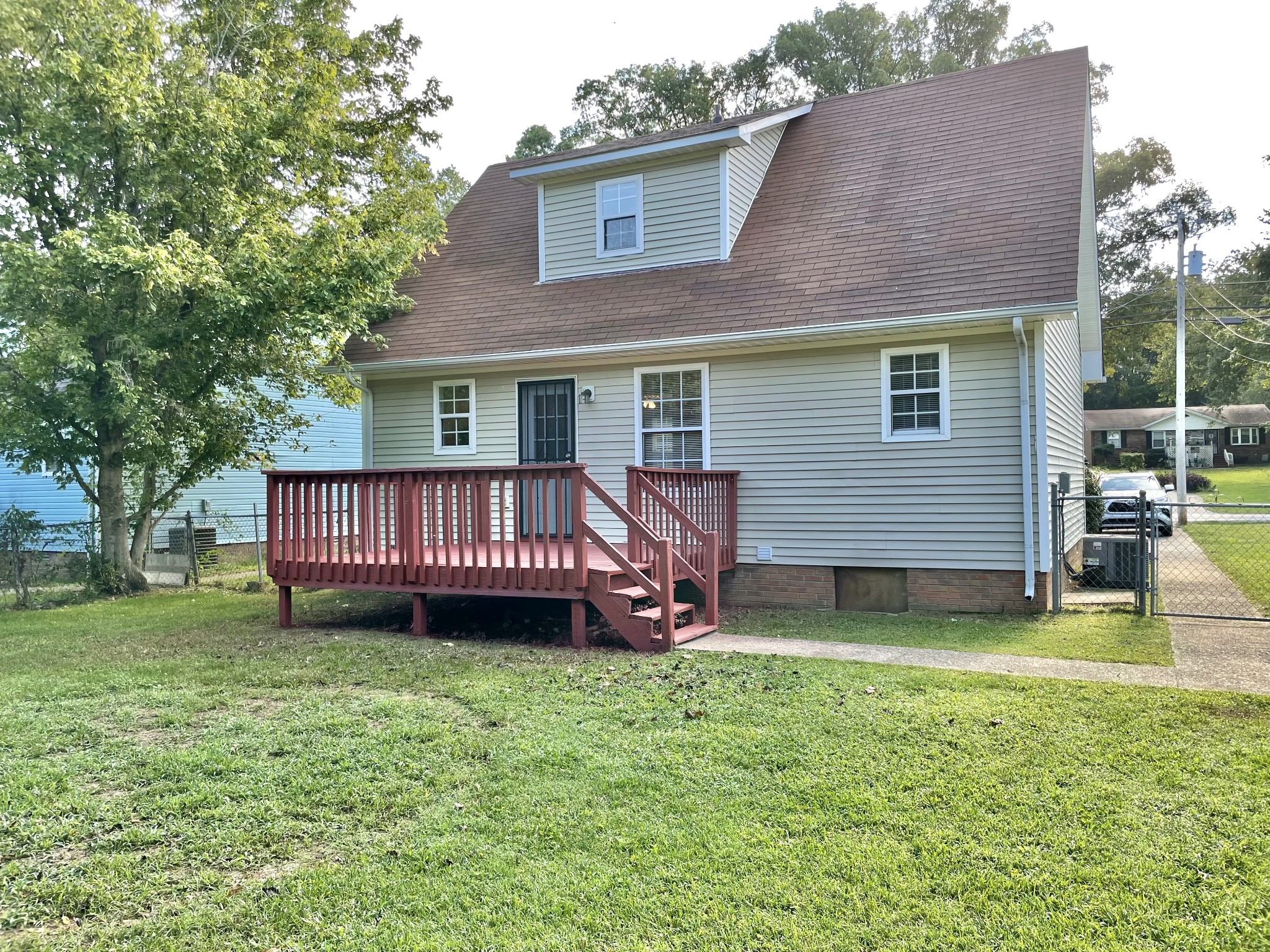 9193 Pembroke Oak Grove Road Oak Grove, KY 42262 - Photo 15 of 16 a view of a house with a backyard and a deck