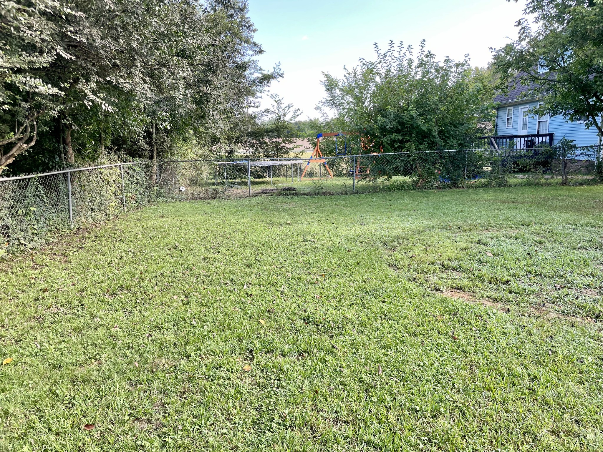 9193 Pembroke Oak Grove Road Oak Grove, KY 42262 - Photo 16 of 16 a backyard of a house with lots of green space
