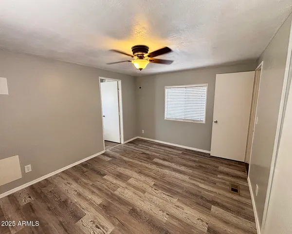 a view of an empty room with a window