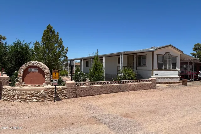 a kitchen with stainless steel appliances white cabinets and a refrigerator