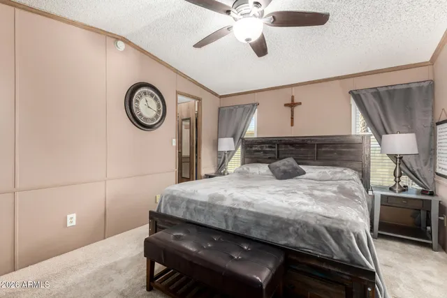 a bedroom with a bed dresser and a closet