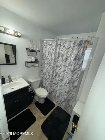 a bathroom with a toilet and a sink
