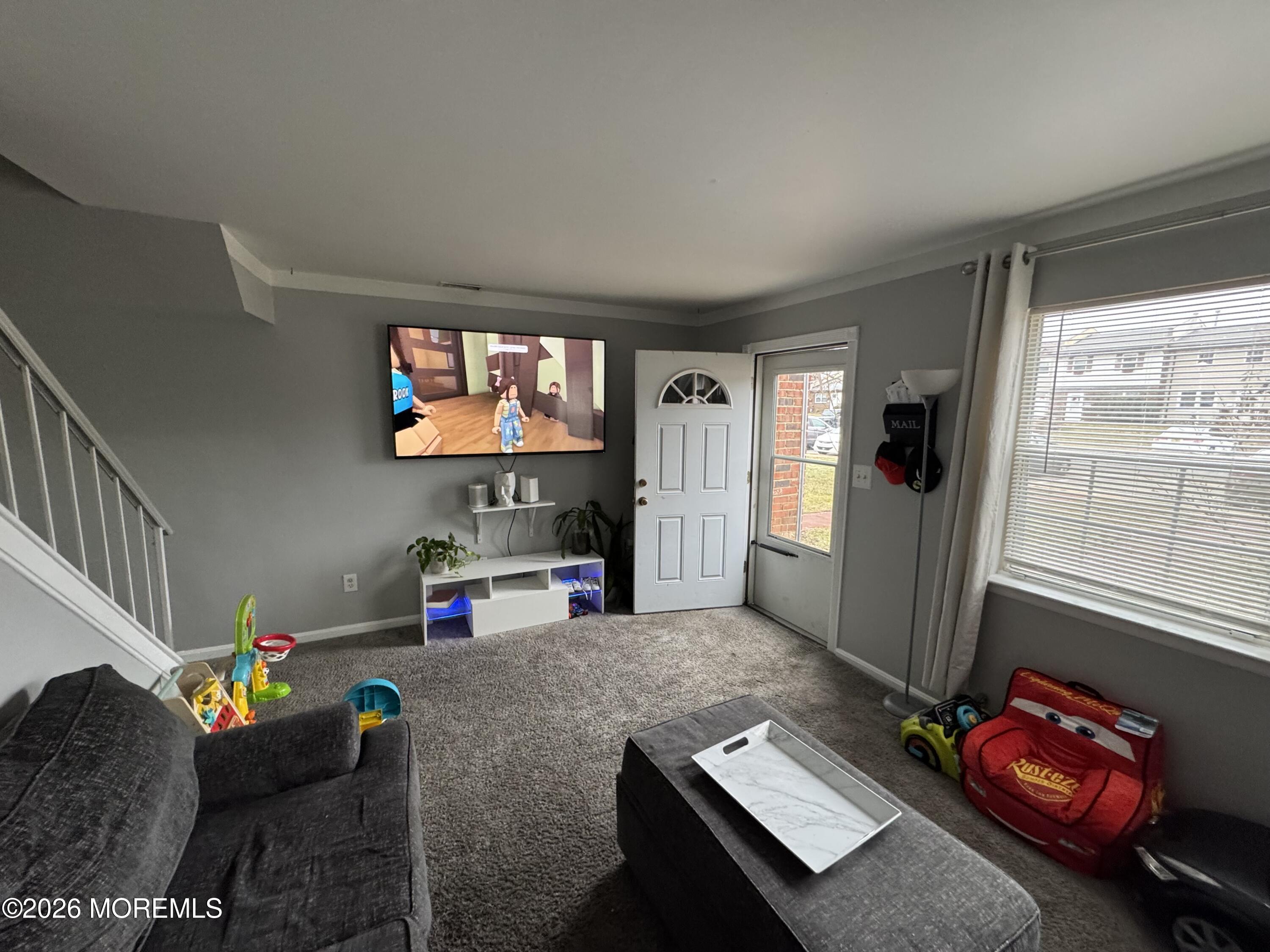 112 Greenwood Loop Road Brick, NJ 08724 - Photo 6 of 14 a living room with furniture and a flat screen tv