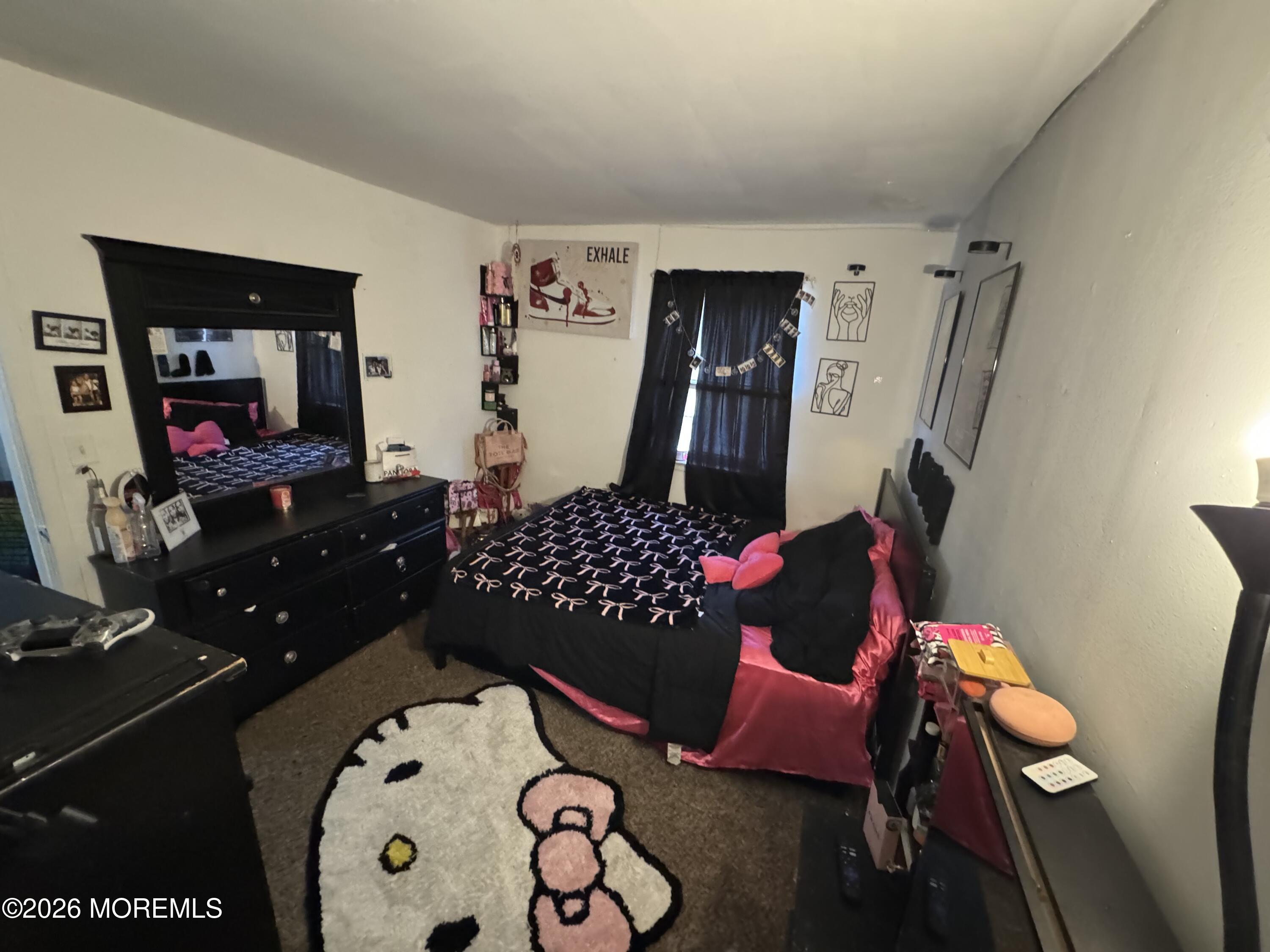 112 Greenwood Loop Road Brick, NJ 08724 - Photo 10 of 14 a living room with furniture and a flat screen tv