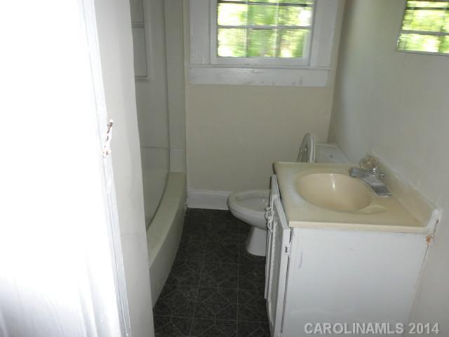 3912 Tuckaseegee Road Charlotte, NC 28208 - Photo 4 of 5 a bathroom with a sink and toilet