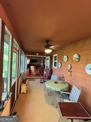 a outdoor living space with furniture and a fireplace