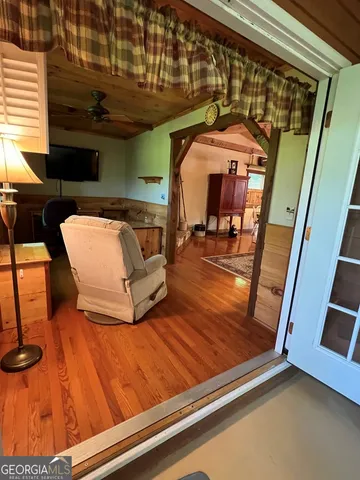 a living room with furniture and a rug