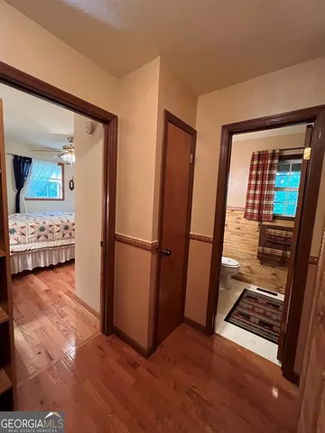a bathroom with a sink mirror and toilet