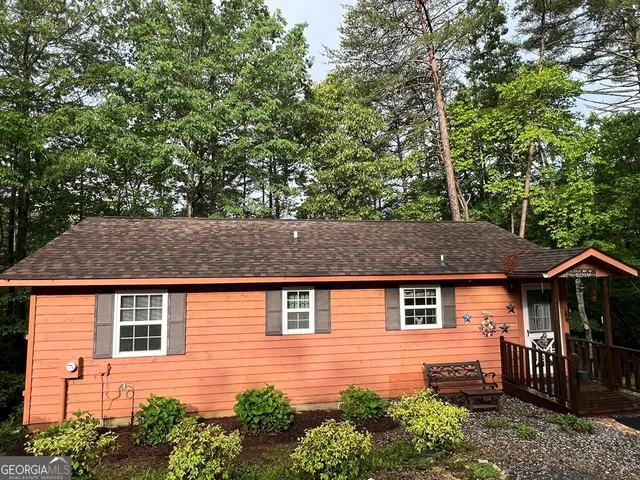 a aerial view of a house with a yard and plants