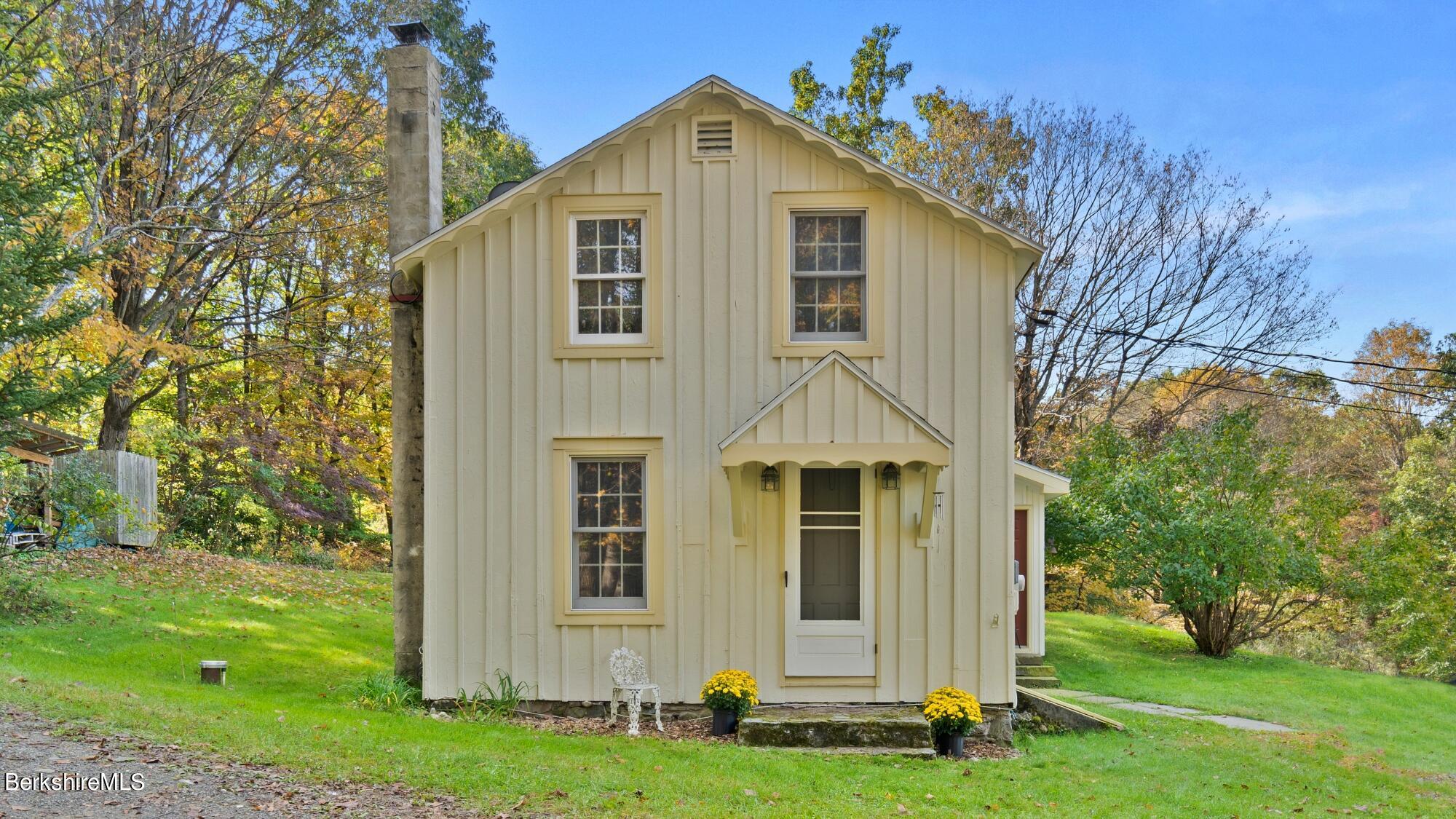 a front view of a house with a yard
