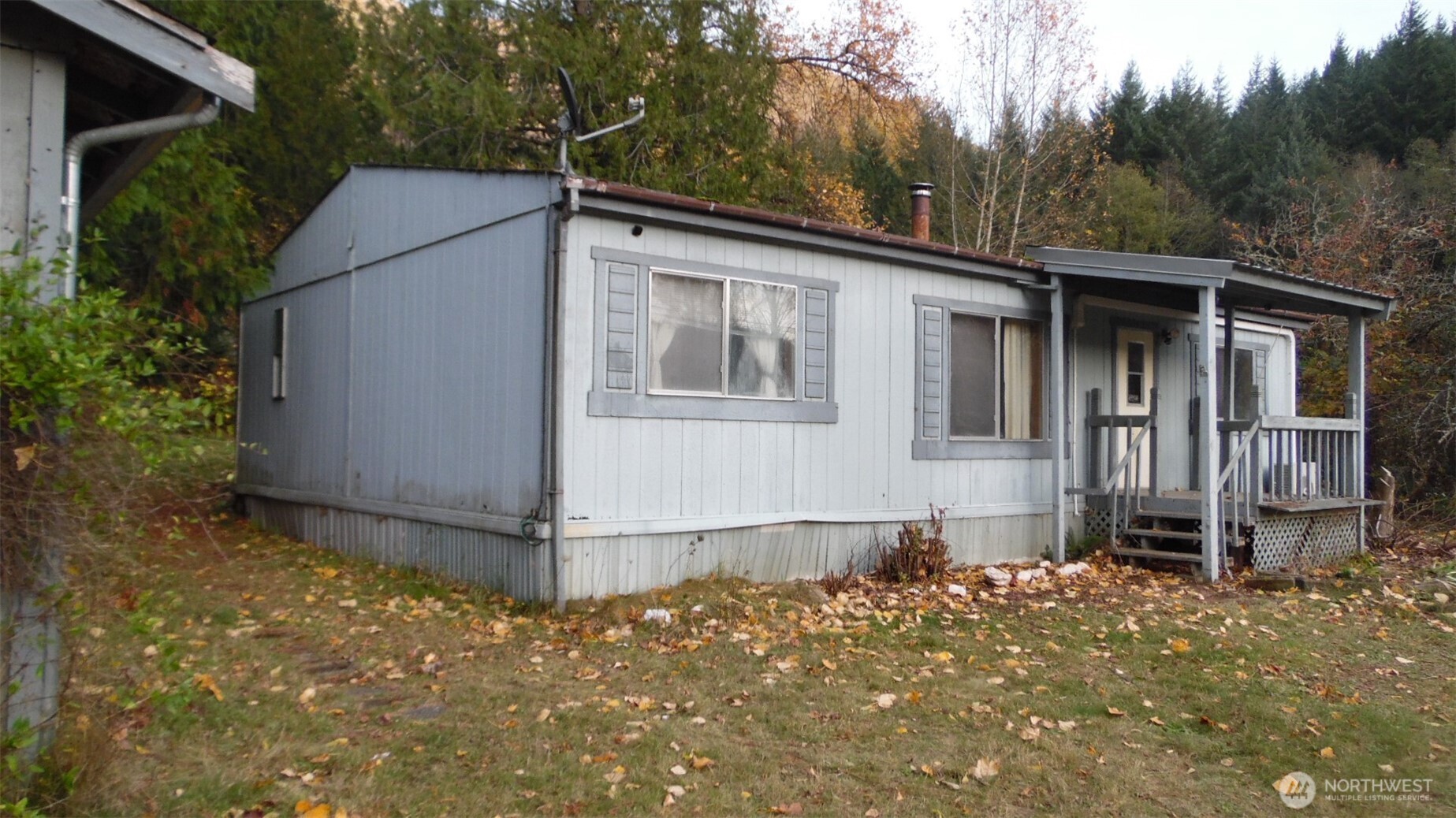 973 Davis Lake Road Morton, WA 98356 - Photo 2 of 23 a backyard of a house with wooden floor and fence