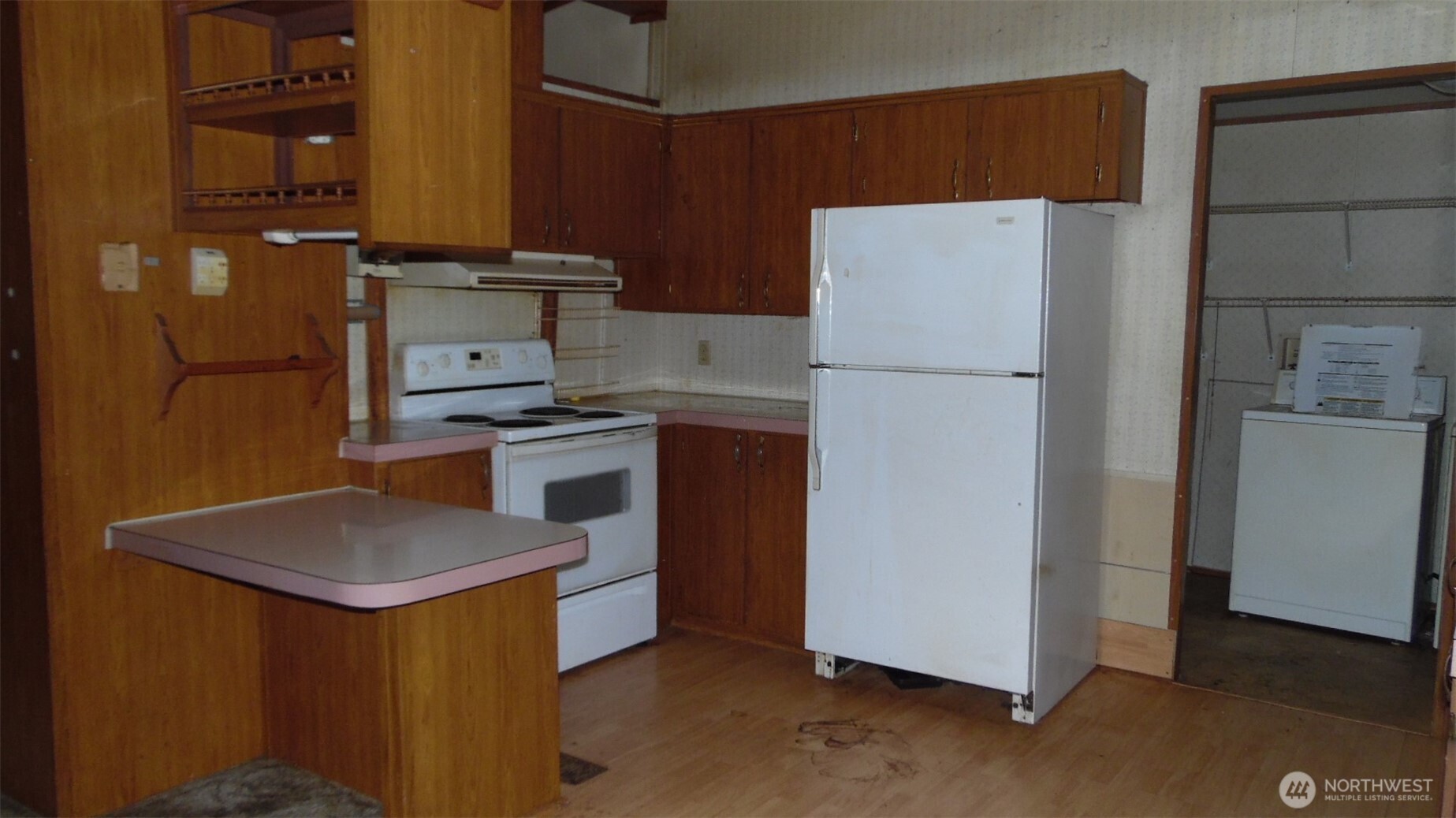 973 Davis Lake Road Morton, WA 98356 - Photo 8 of 23 a white refrigerator freezer sitting inside of a kitchen