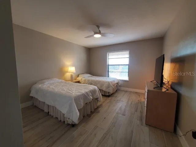 a bedroom with bed and window
