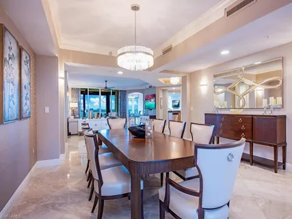 a living room with furniture ceiling fan and a rug