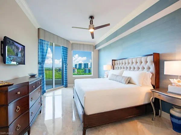 a bedroom with two beds and a table