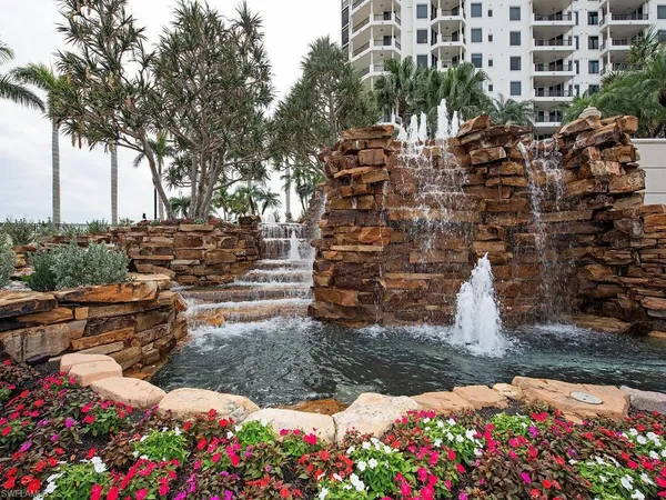 a swimming pool with outdoor seating and yard