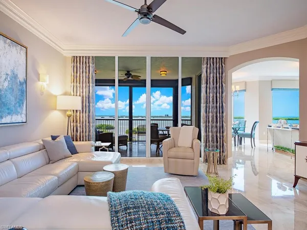 a kitchen with stainless steel appliances granite countertop a sink refrigerator and cabinets