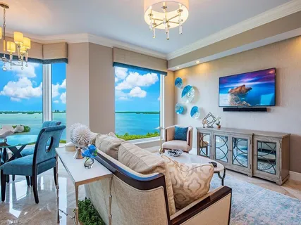 a kitchen with stainless steel appliances granite countertop a sink counter space cabinets and a large window