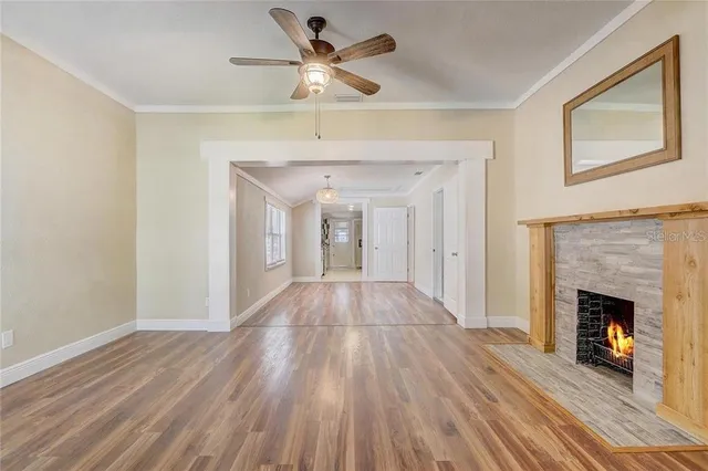 a view of an empty room and wooden floor