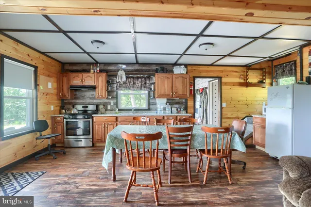 a view of a dining room with furniture window and outside view