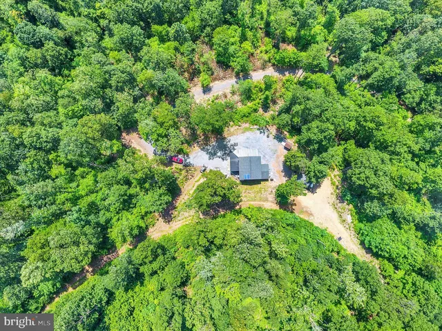 a aerial view of a house with a yard