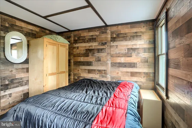 a bedroom with a bed and a walk in closet